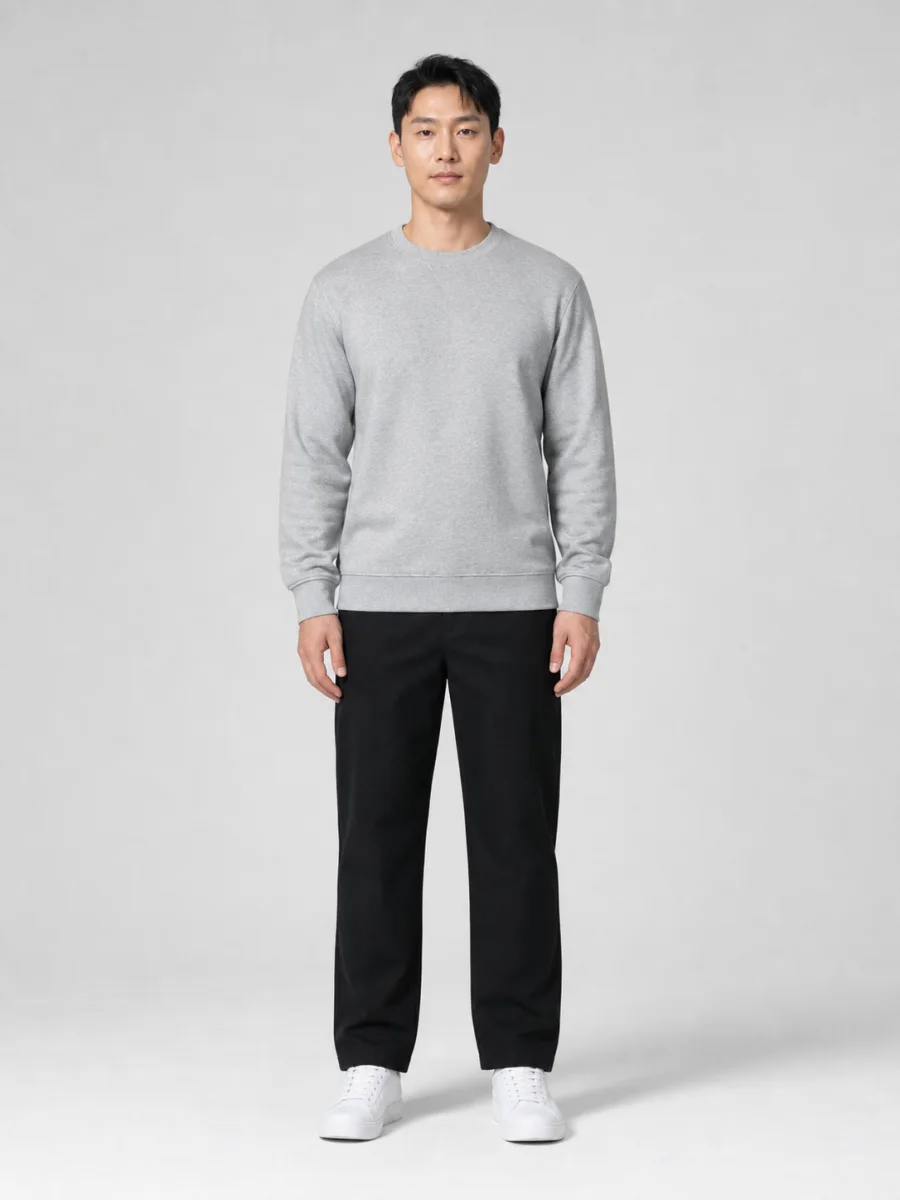 Man in gray sweatshirt before AI clothes changer